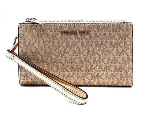 michael kors jet set gold clutch|Michael Kors large wristlet clutch.